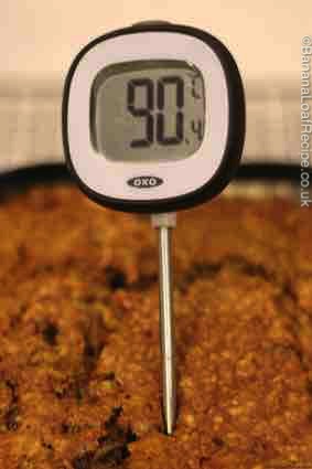 Using a thermometer to test if your cake is cooked