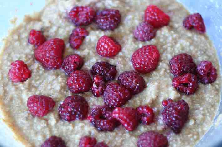 adding raspberries to the Banana and Raspberry Loaf mixture